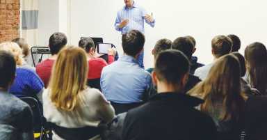 Adult,Students,Listen,To,Professor’s,Lecture,In,Small,Class,Room.